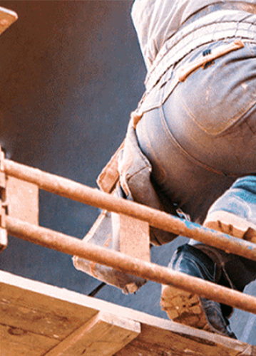 Scaffolder working on a commercial scaffold structure